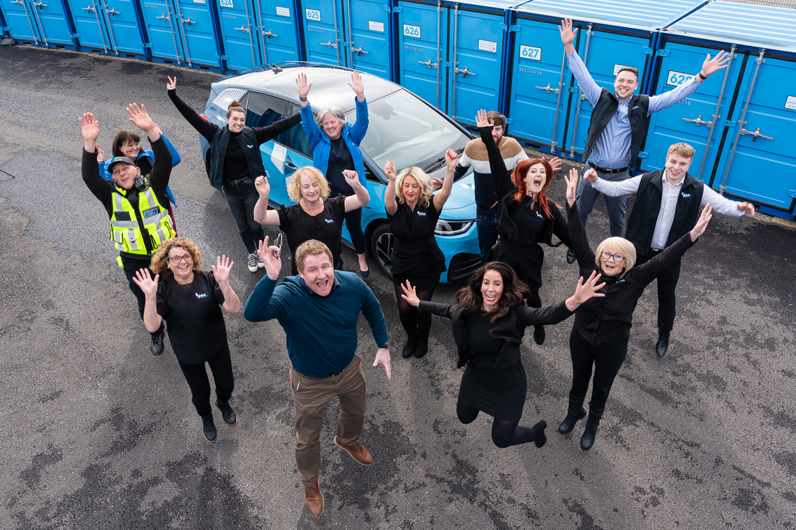 blue self storage people jumping