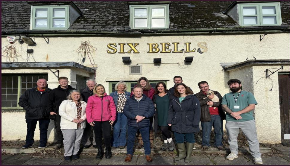 Villagers with MP outside Six Bells Inn